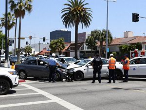 Car accident scene in Los Angeles with police and damaged vehicles
